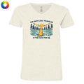 Beige t-shirt with a graphic design of a dog by a lake and text on a white background