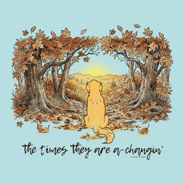 A square graphic print featuring an illustration of a golden retriever sitting in the center of an autumn forest with falling leaves and mountains in the distance under a yellow sun. Below the illustration, the phrase 'the times they are a-changin'' is written in black script.