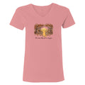 A pink short-sleeve V-neck t-shirt with a central graphic of a yellow dog sitting in a forest with the text 'The dogs they are a family' printed below it, shown on a plain white background.