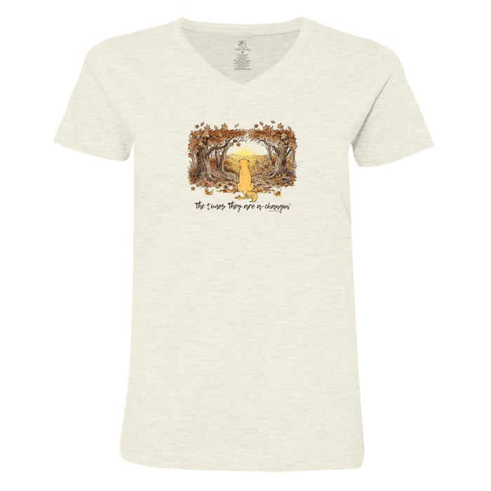 An off-white heathered V-neck t-shirt featuring a central graphic of a golden mushroom surrounded by brown leaves, with the text 'No trees they are no sleepin'' printed below.